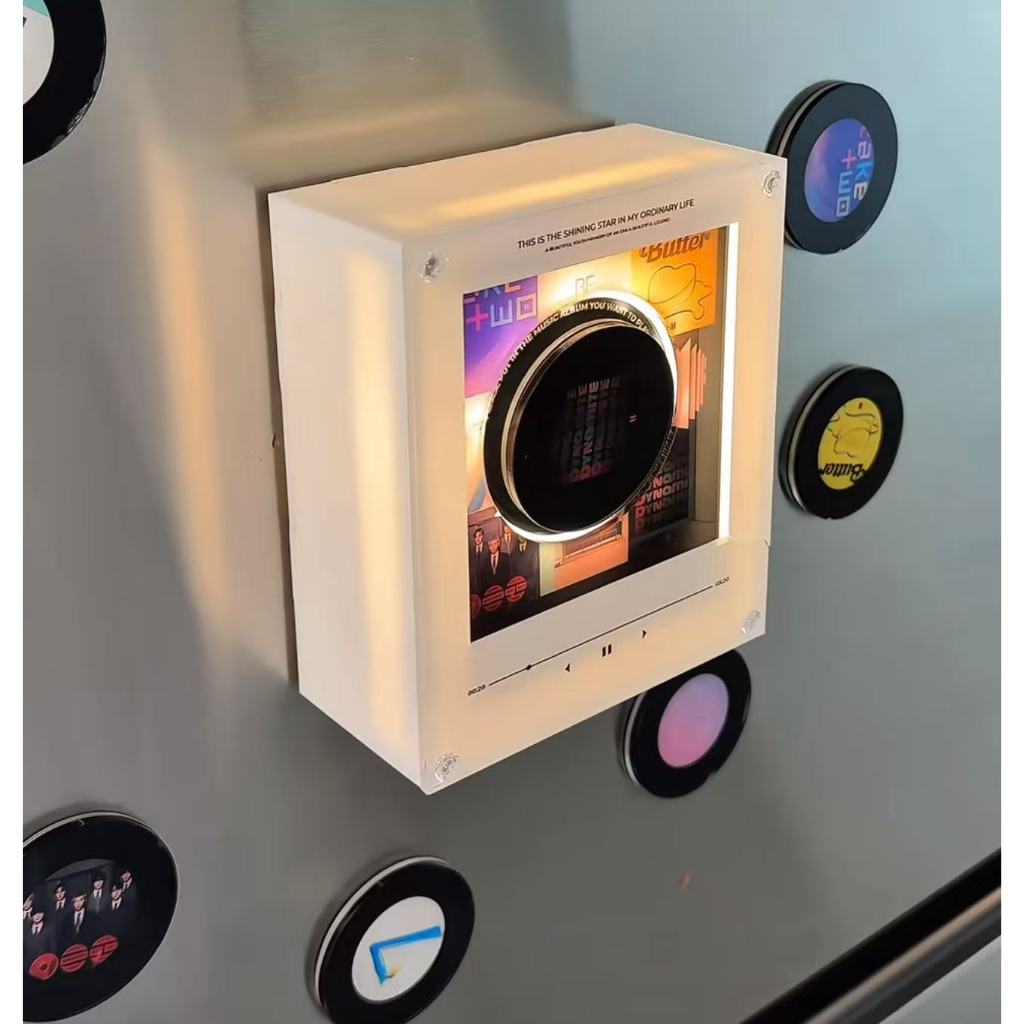 NFC song fridge magnet lamp glowing on a refrigerator with a miniature record-style player